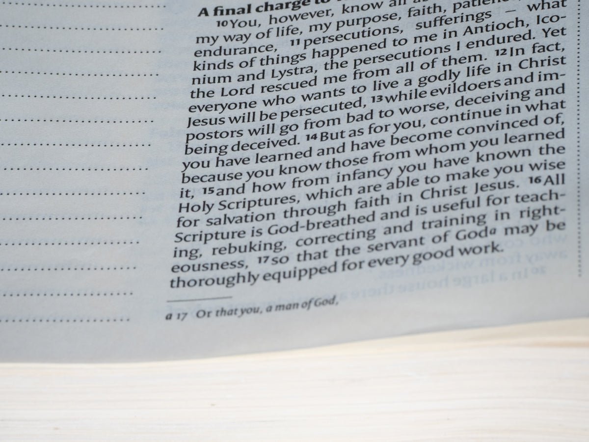 Text from the bible is shown on the page.